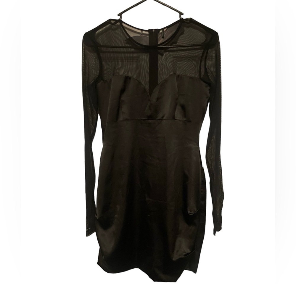 Black mesh sleeve and black silk mini dress.